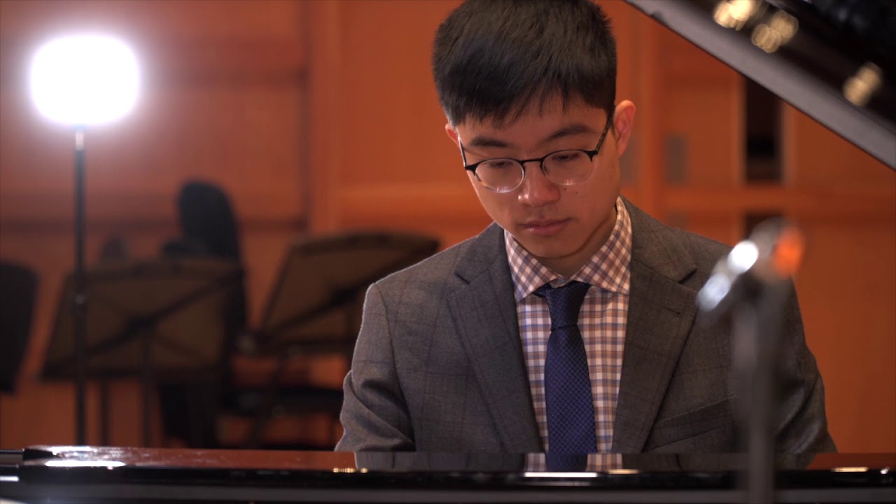 KMMS Student Michael Lam performing on the piano