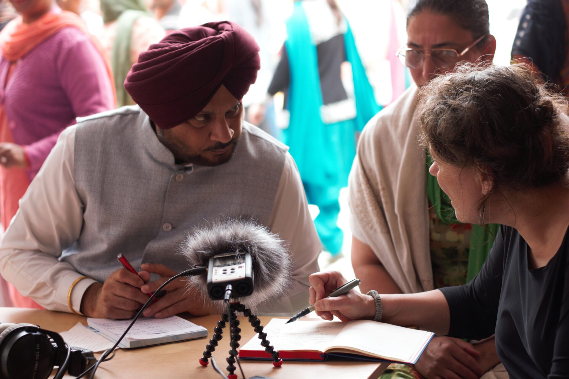 Sikh man and woman being interviewed