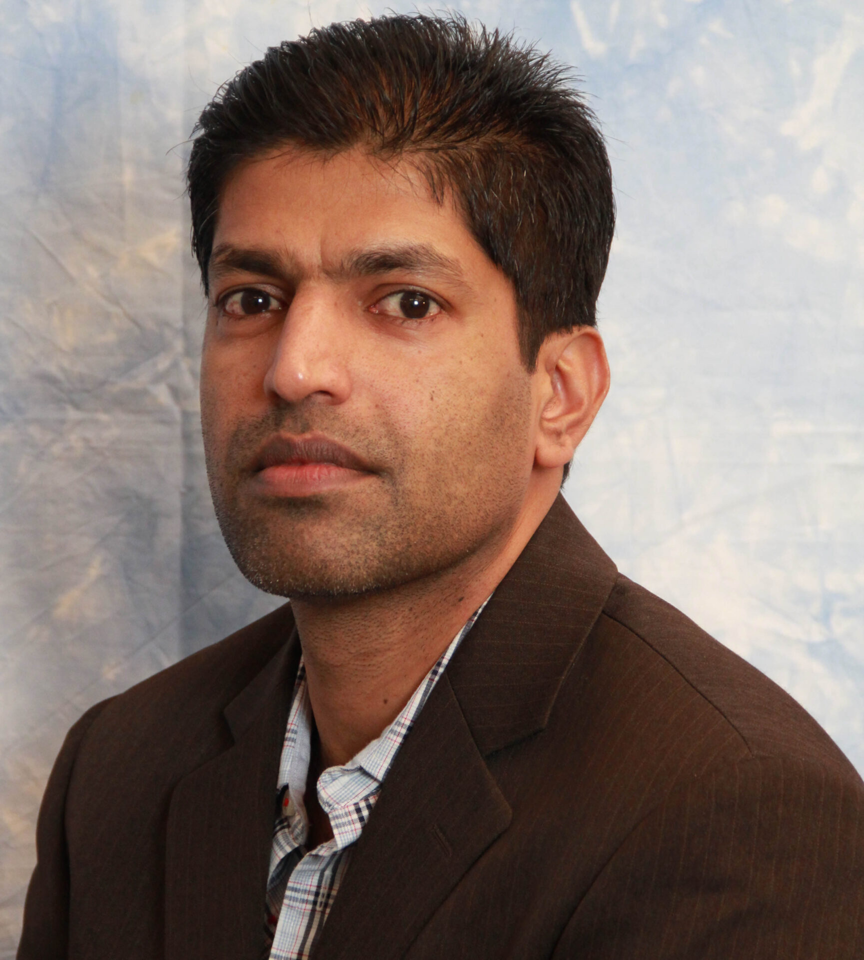 Portrait of MR Kurian George 